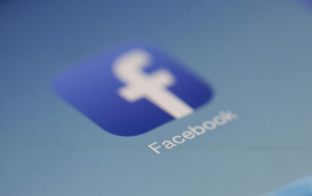 pexels-photo-267399-267399 Close-up view of the Facebook app logo on a digital screen with blurred background.